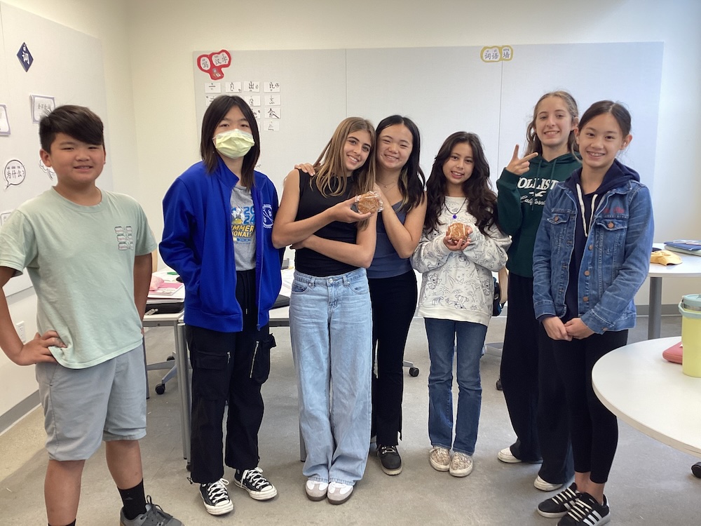 Middle Schoolers Celebrating with Moon Cakes